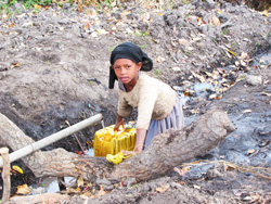 girl filling a jug